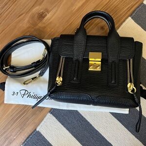 3.1 Phillip Lim Black and Gold Crossbody Bag with Structured Design